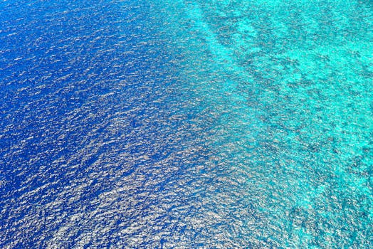 Stunning aerial view capturing the vibrant blue ocean waters of Central Kalimantan, Indonesia.
